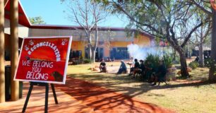 Image of men sitting around the yarning circle at a Reconciliation Day event at West Kimberley Regional Prison