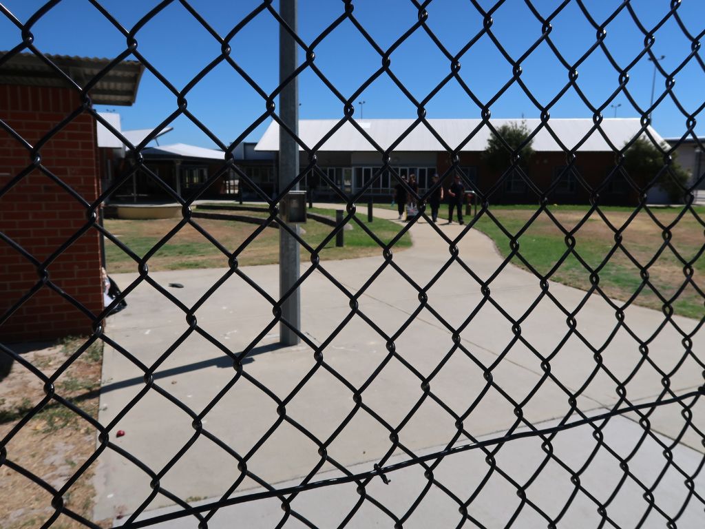 Image of looking through wire fence to a standard male unit, at Banksia Hill Detention Centre.