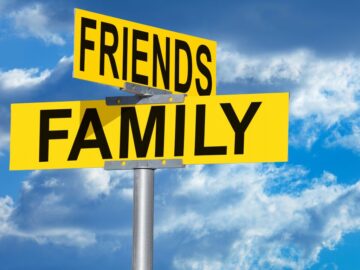 Image of a street sign with the words 'Friends' & 'Family' on.